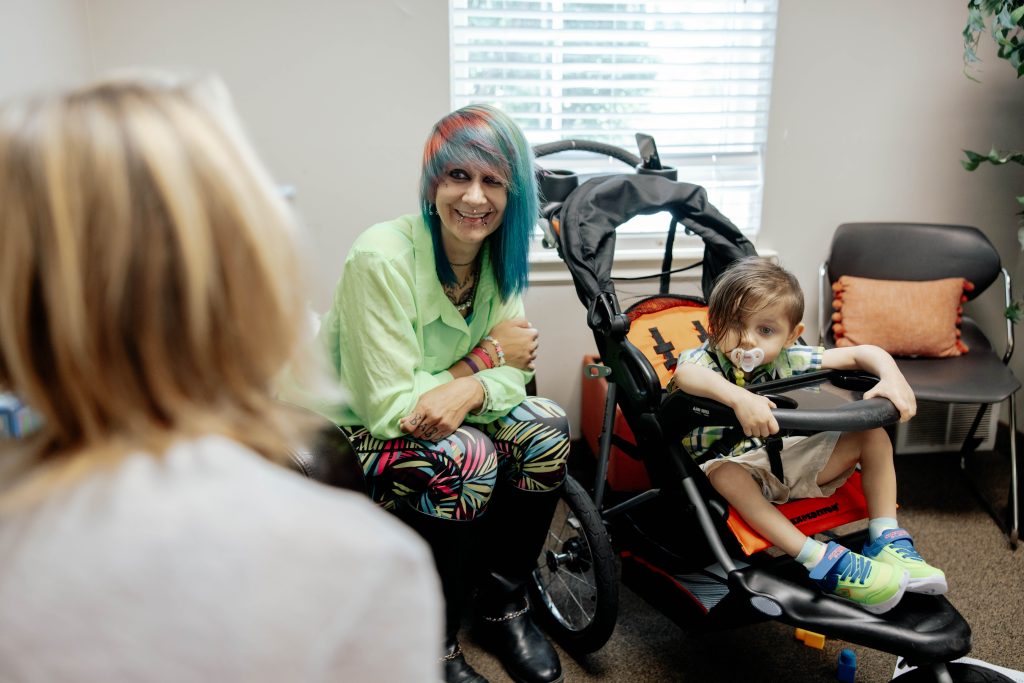 Young mom with her son receiving support services at Alpha Grand Rapids.