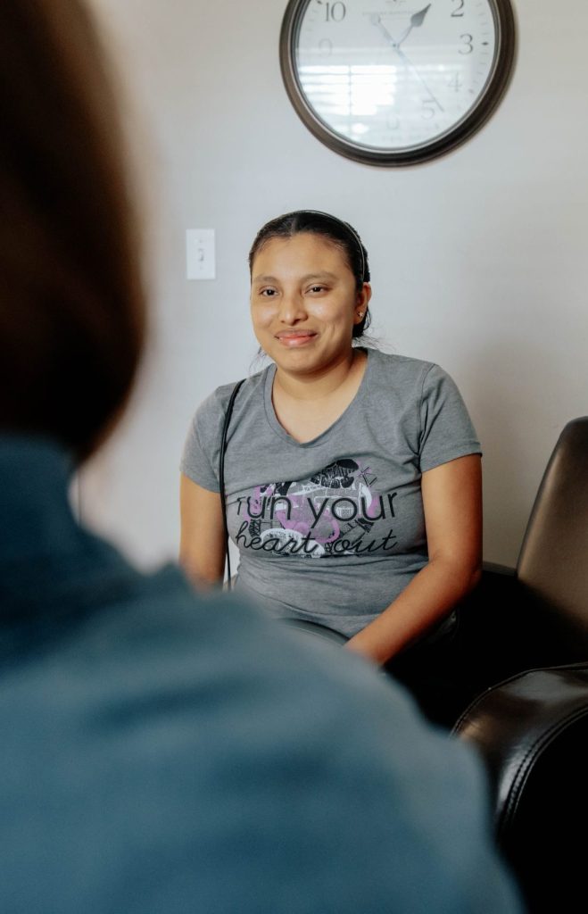 Woman receiving support services from Alpha Grand Rapids