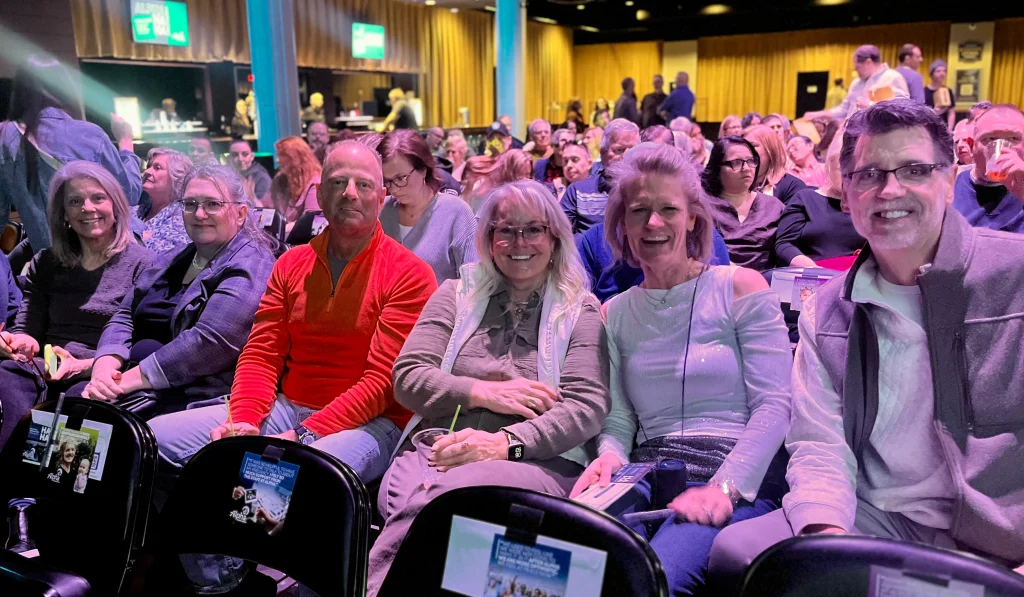 Attendees laughing at Alpha Grand Rapids Comedy Night Event
